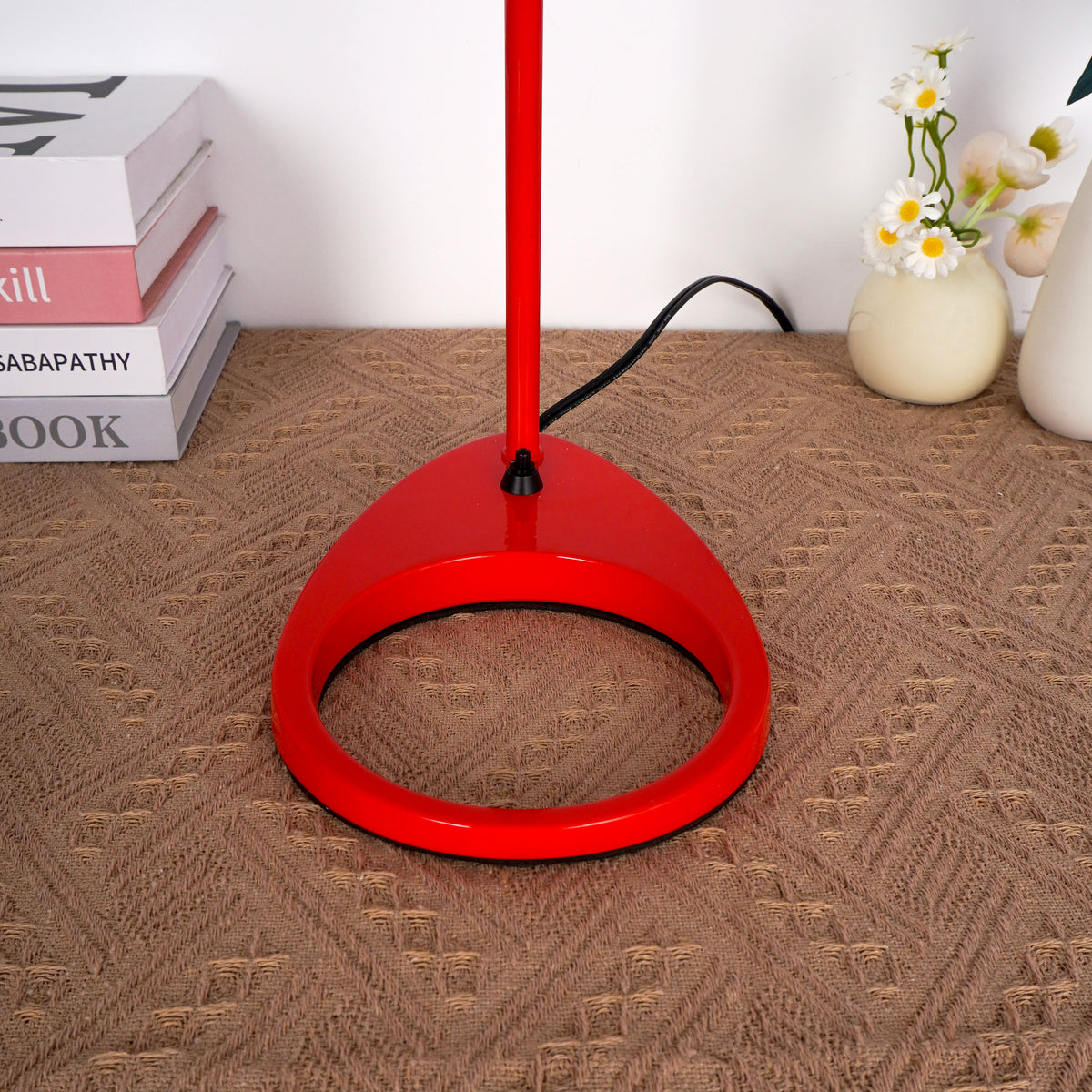 close up of the red table lamp's base