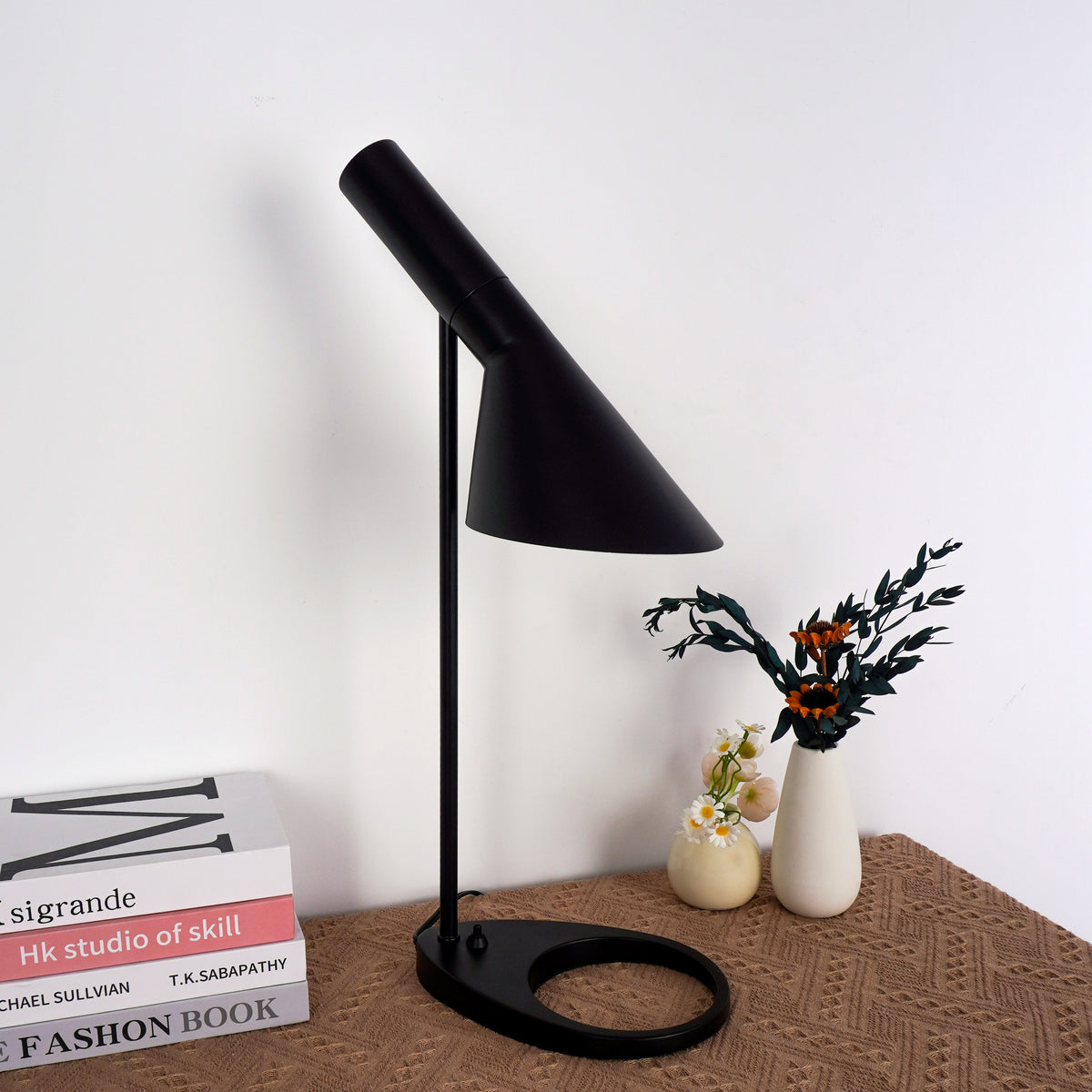 Architectural black lamp complementing concrete wall and industrial decor