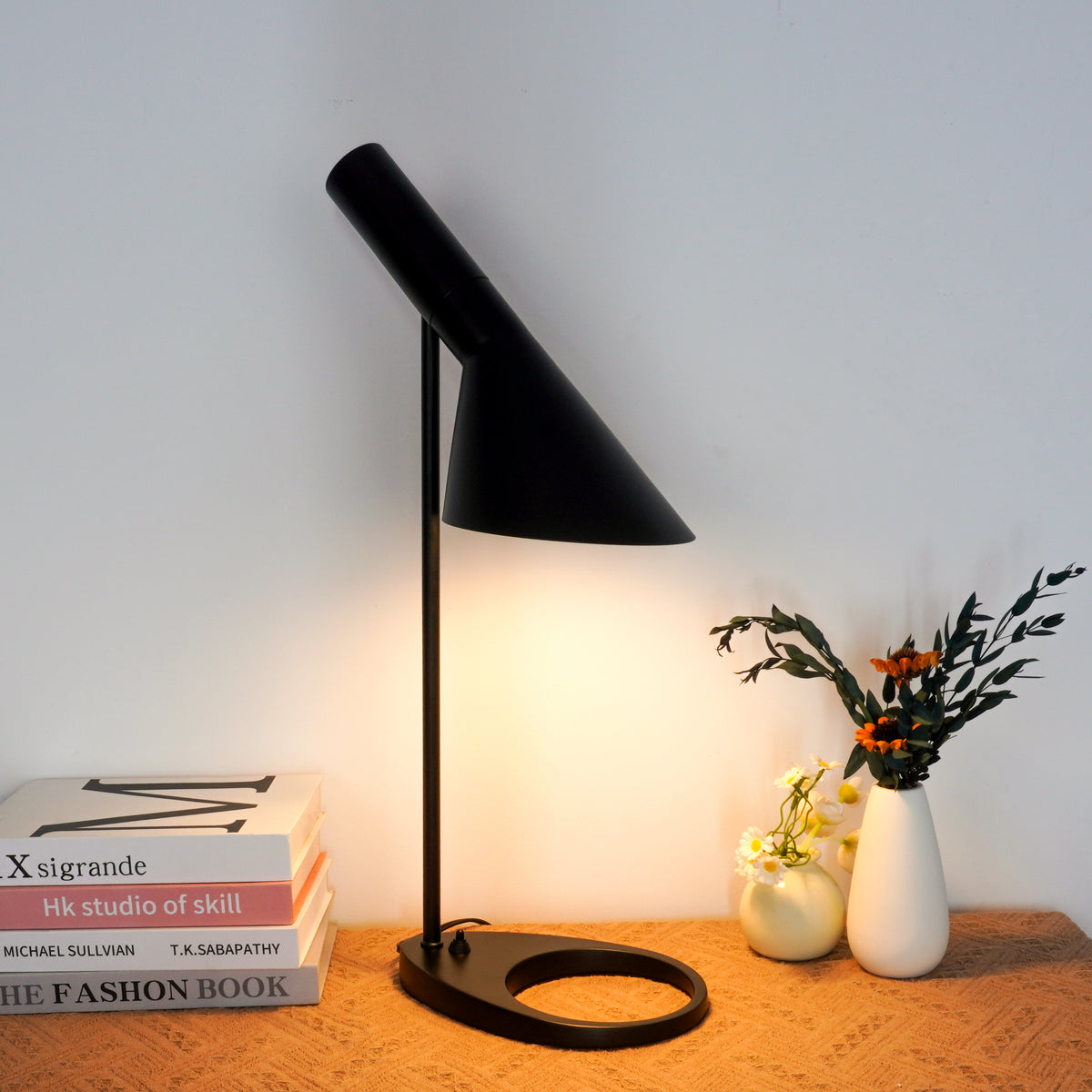 Dual-tone black lamp featuring satin exterior and glossy interior surfaces