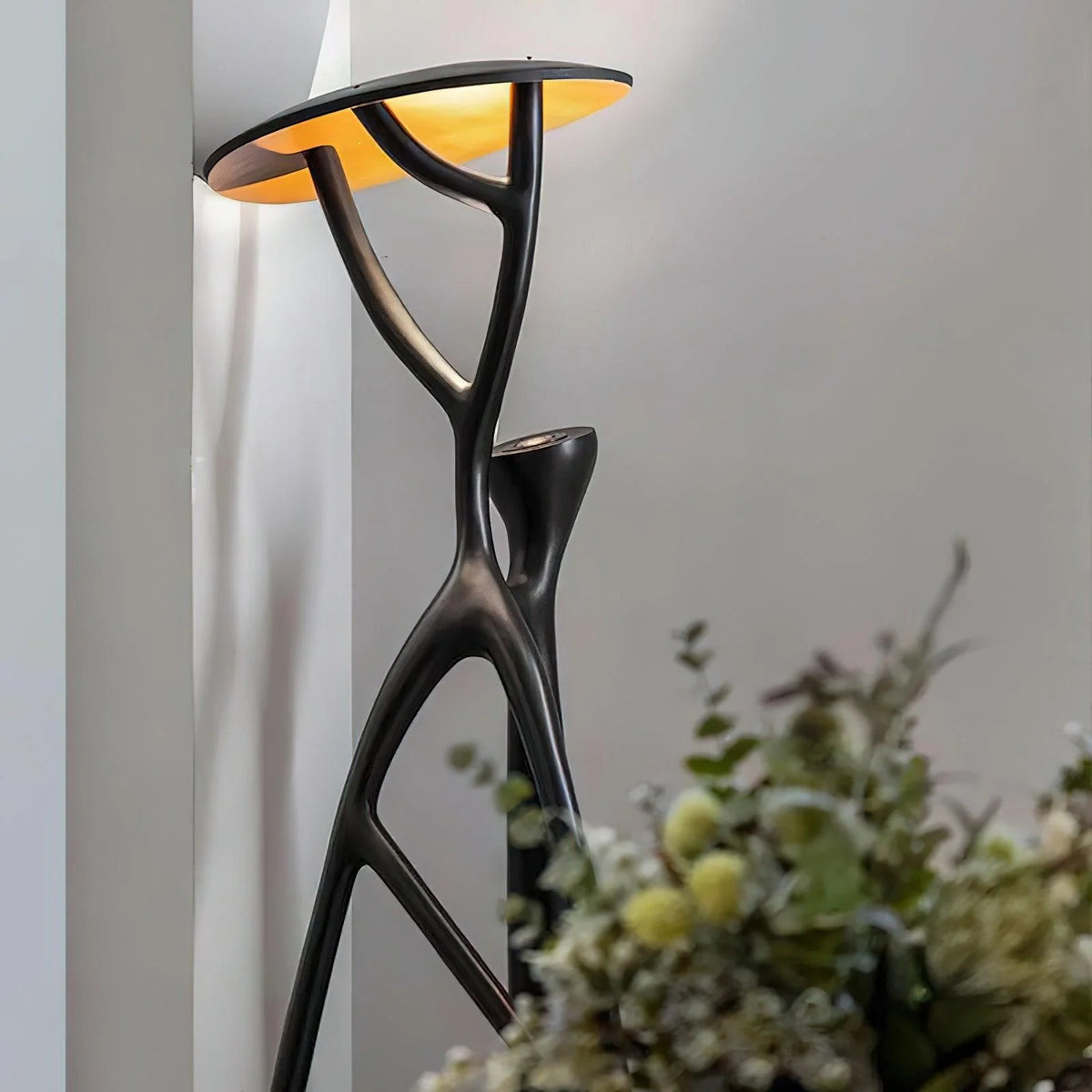 Creative Floor Lamp: Black branch design blends art and function for home decor.