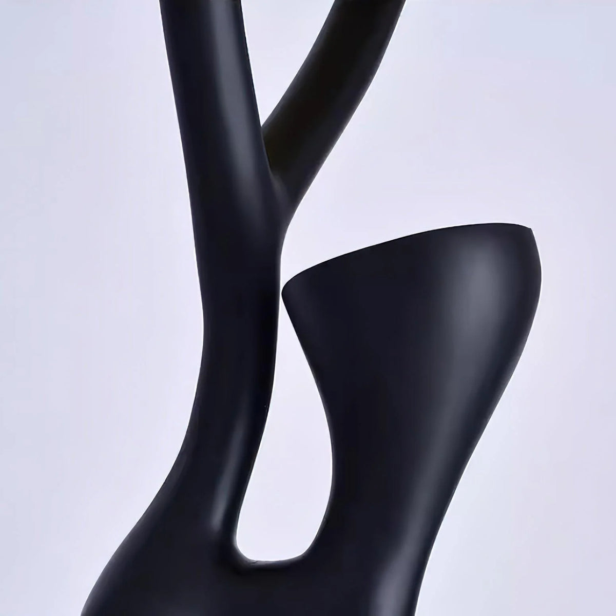 Modern Floor Lamp: Black branch structure offers stylish illumination for living areas.