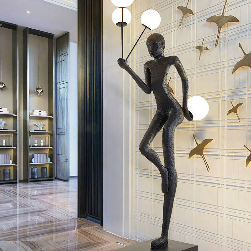The black human sculpture floor lamp is unique, creating an elegant and artistic atmosphere.