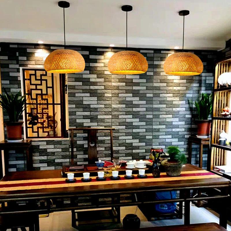 Three Bamboo Basket Pendant Lamps hang side by side above the coffee table