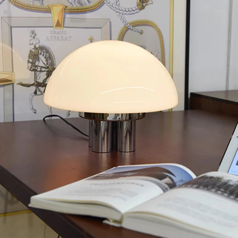 With white glass and a metallic base, this Bauhaus lamp delivers understated charm for decor elevation.