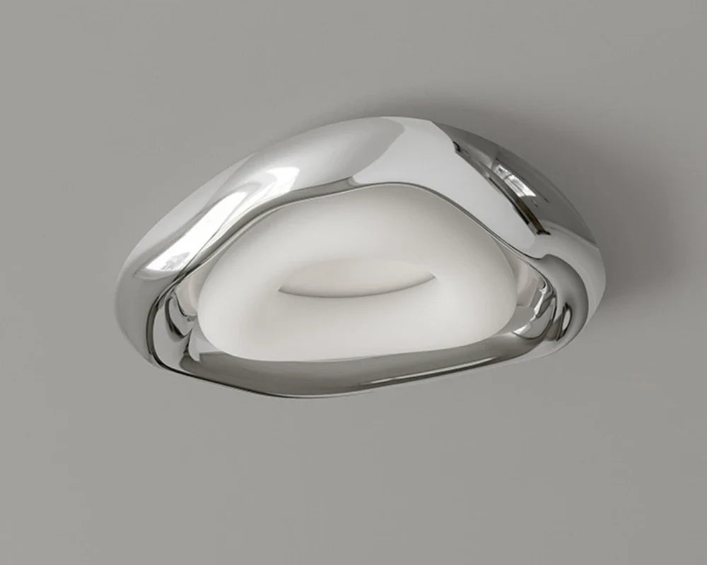 Bauhaus-inspired ceiling light merges art and utility for stylish room decor.