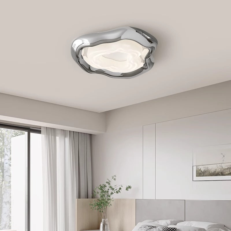 Modern ceiling light with fluid, organic shape enhances room’s contemporary vibe.