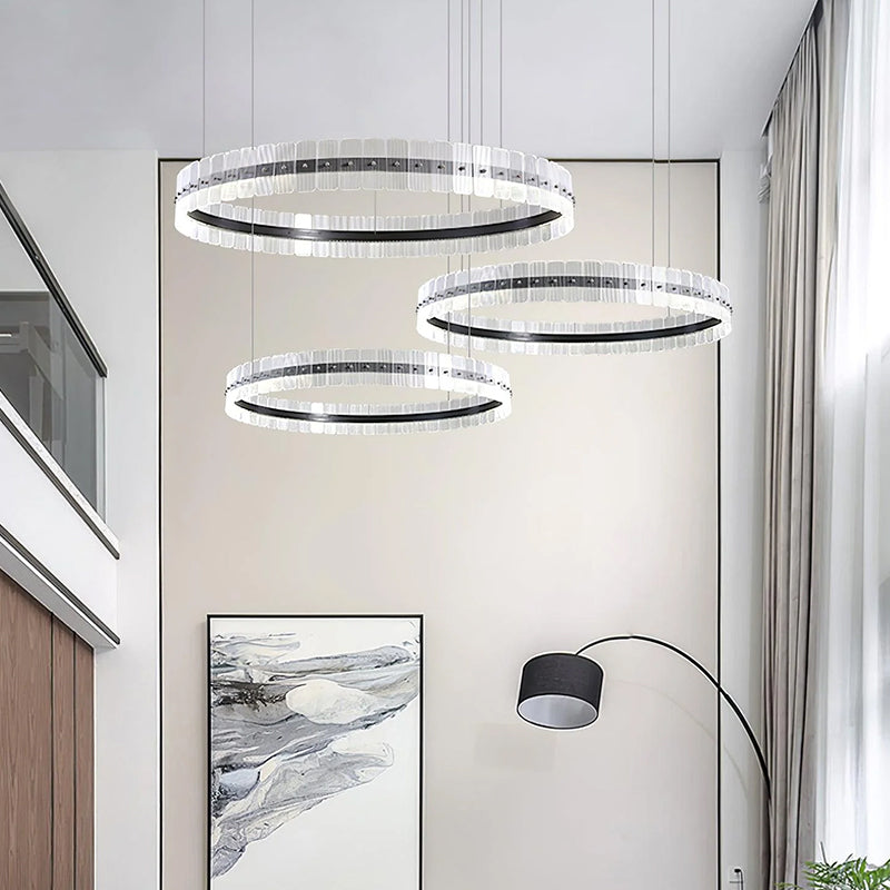 When you step into this interior space, your eyes are immediately attracted by three circular chandeliers. They are hung in a cleverly staggered manner.
