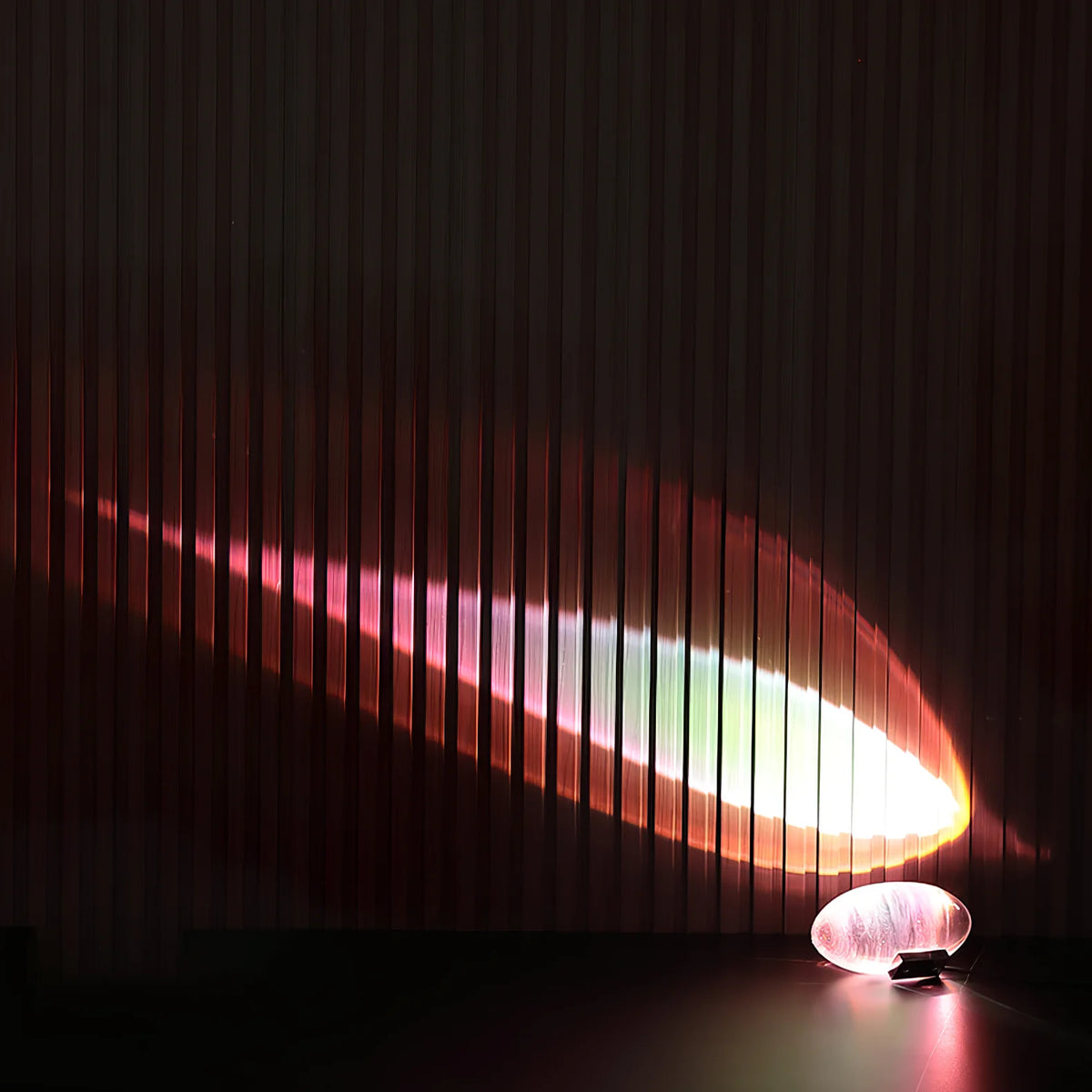 Functional art: bullet-shaped lamp with projection suits contemporary spaces.