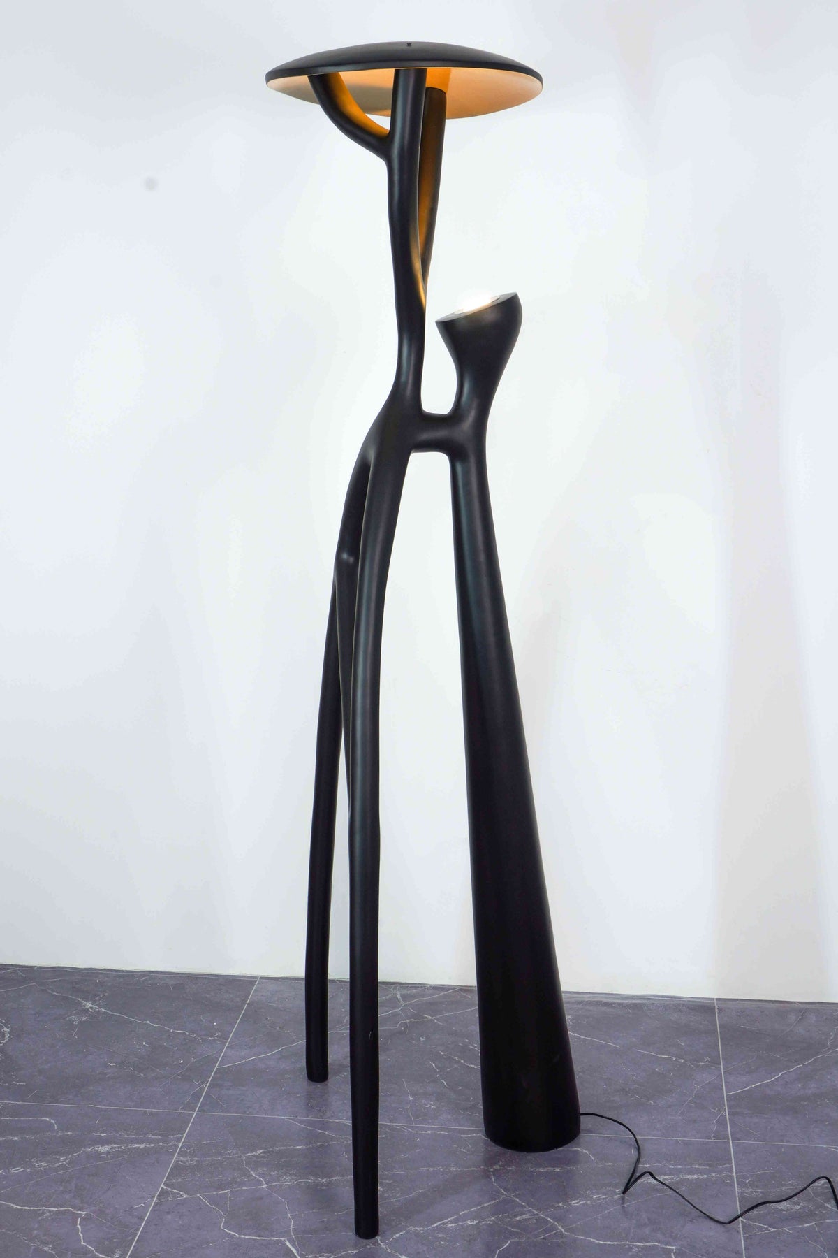 Artistic Floor Lamp: Black branch design perfect for contemporary living room decor.