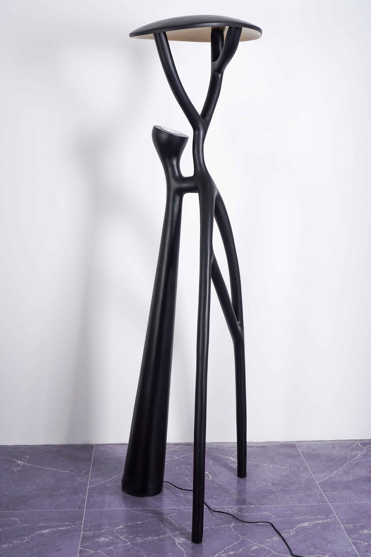 Unique Lighting: Artistic branch floor lamp enhances living spaces with modern charm.