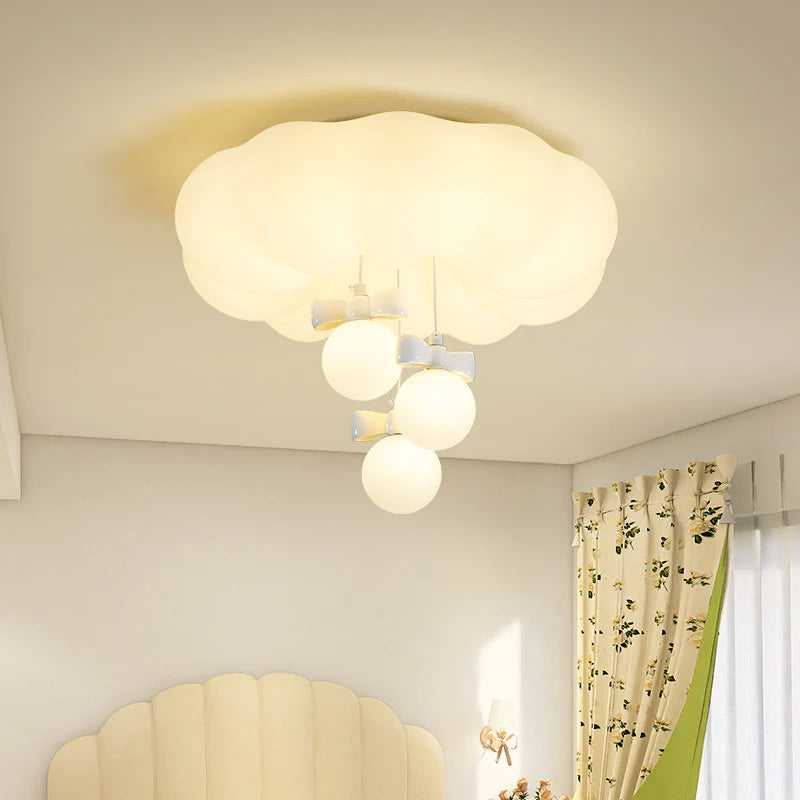 Three glass lampshades with bows are hung under the cloud lamp body. This lamp is very popular with children