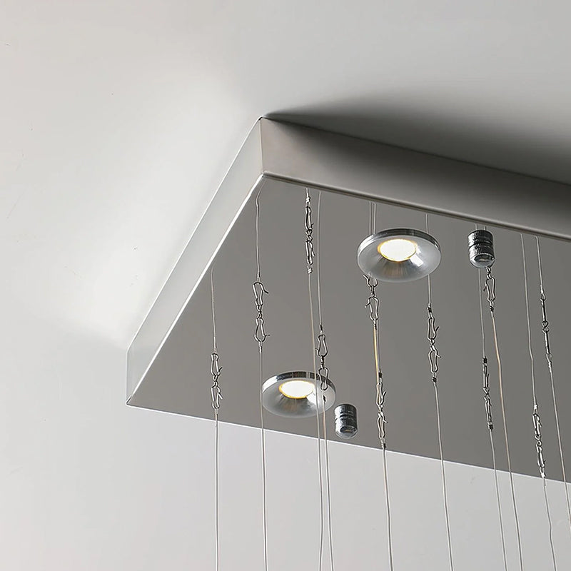 Detail of the Cross Star Chandelier's chrome chassis and spotlights