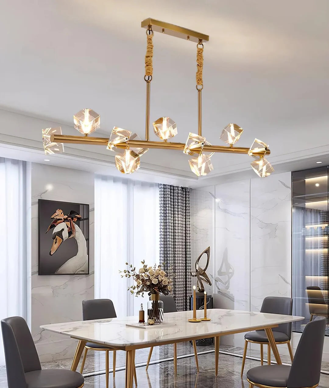 A stylish Polyhedron Crystal Chandelier hangs above the dining table, casting a warm glow. Its golden frame and faceted crystal elements add a touch of luxury to the modern - decorated dining room.