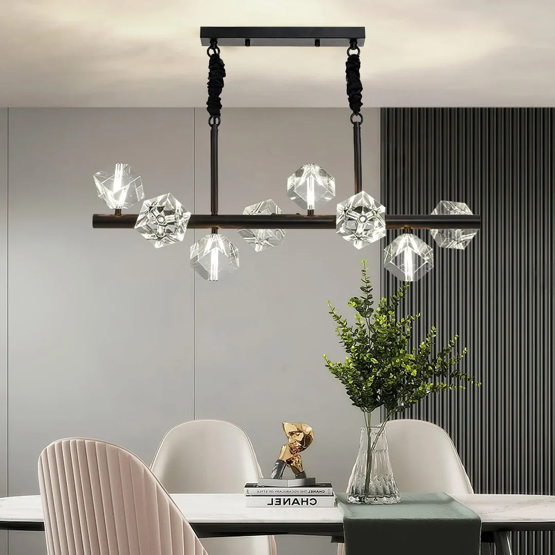 The Polyhedron Crystal Chandelier with black body is installed on the dining table.
