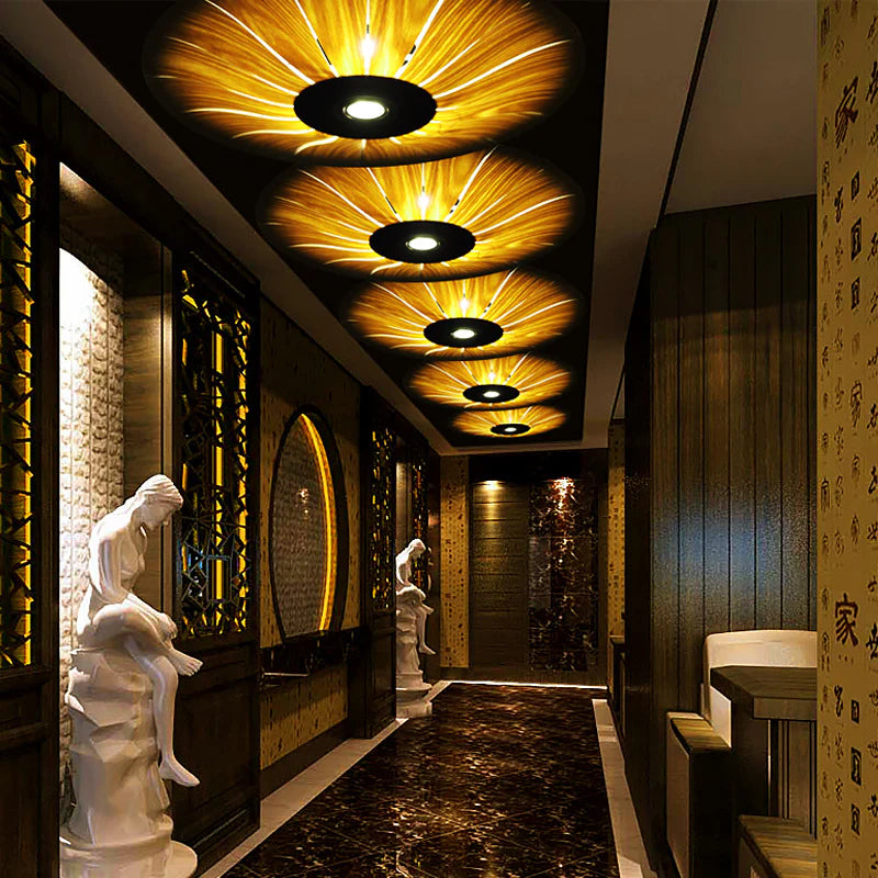 5 vintage round wooden ceiling lamps decorate the quaint hallway.