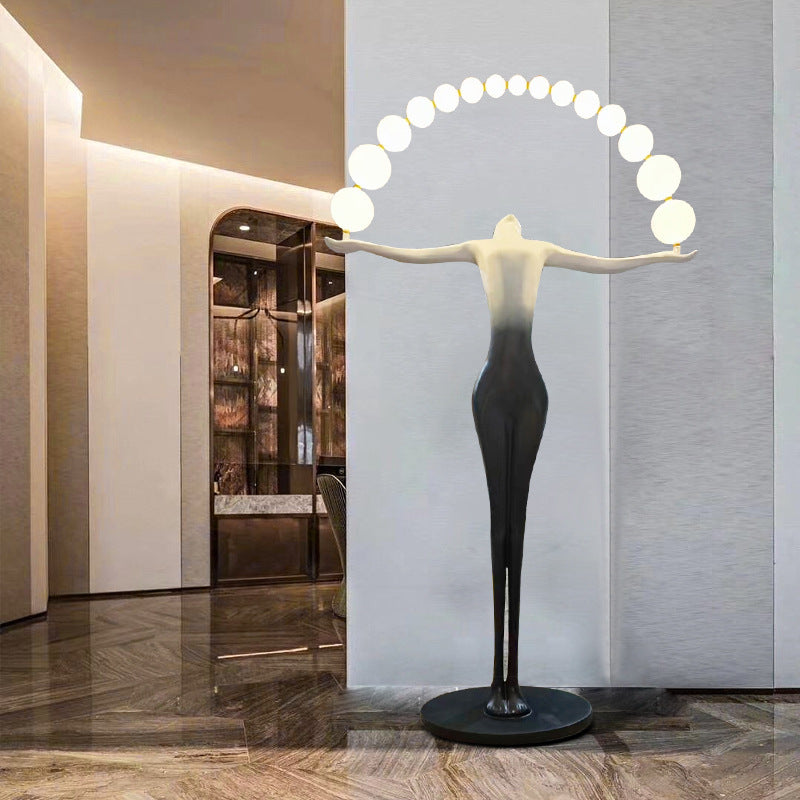 When the human-shaped floor lamp is lit, the light emits a soft light through the sphere, which not only provides lighting, but also looks like a modern art sculpture, adding a unique artistic atmosphere and fashion style to the interior space.