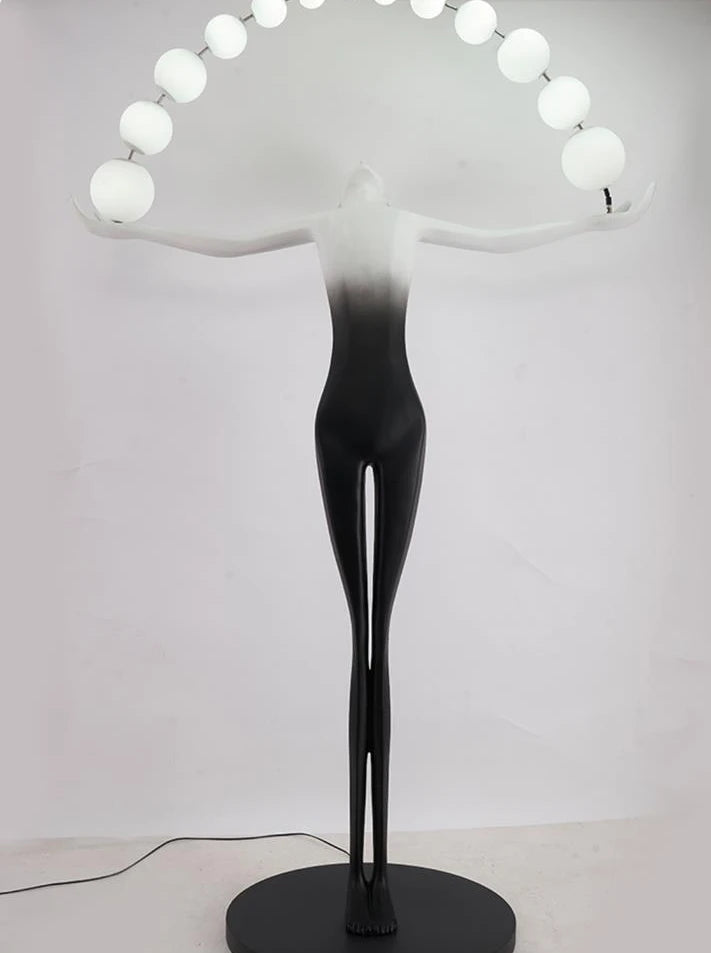 The front view of the black and white human floor lamp