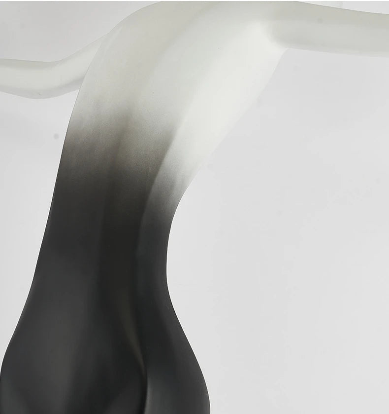 The human waist detail of the sculptural floor lamp
