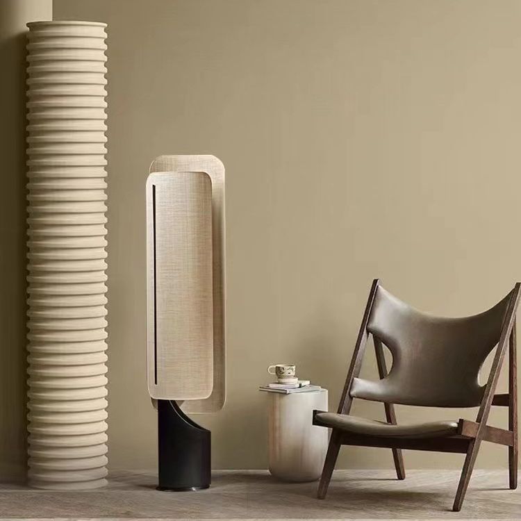 Stylish Ibiza Floor Lamp: Features a metal base supporting a cloth lampshade, creating a warm ambient glow.