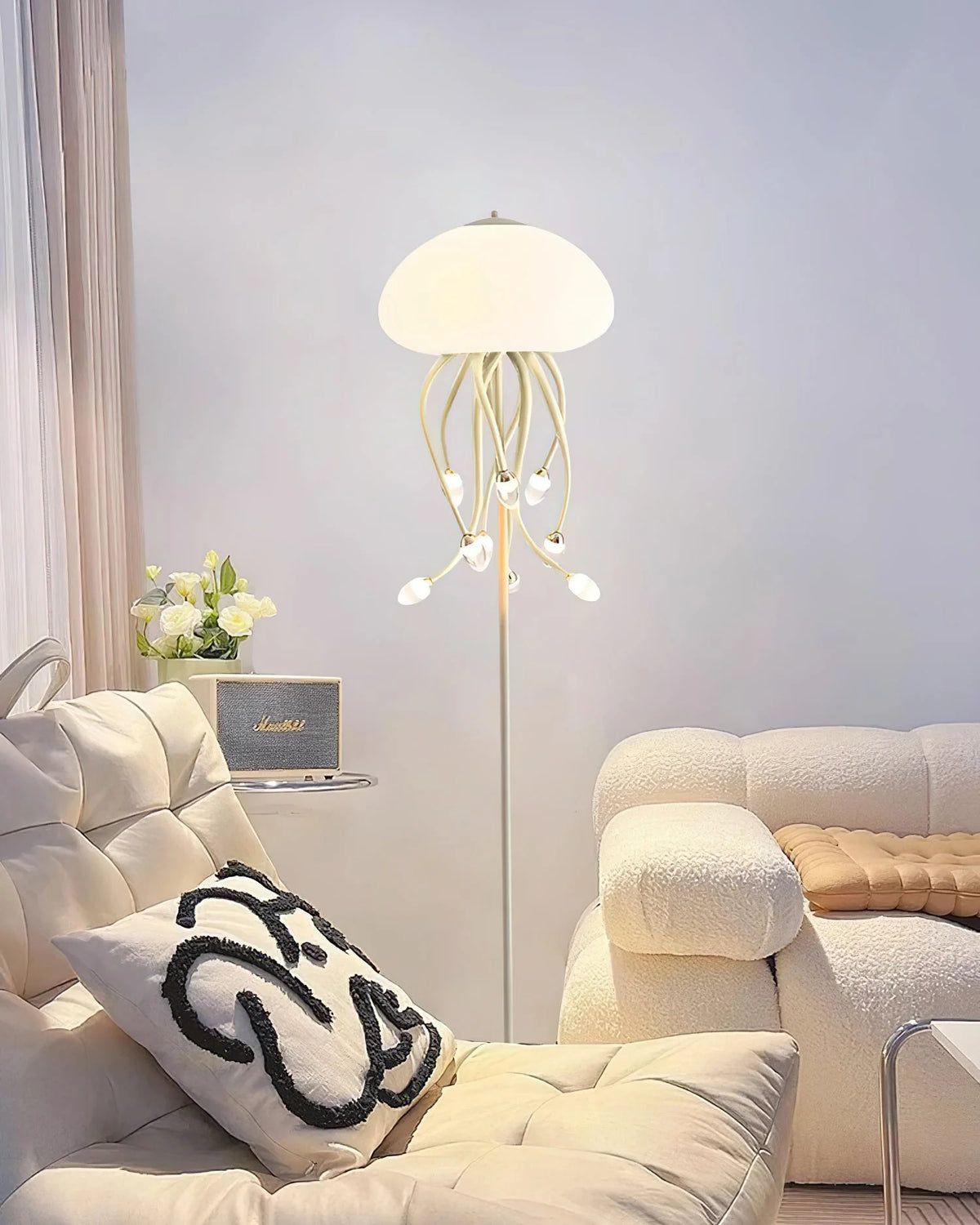 Stylish floor lamp features a tall metal stand and soft acrylic elements, perfect for room decor.