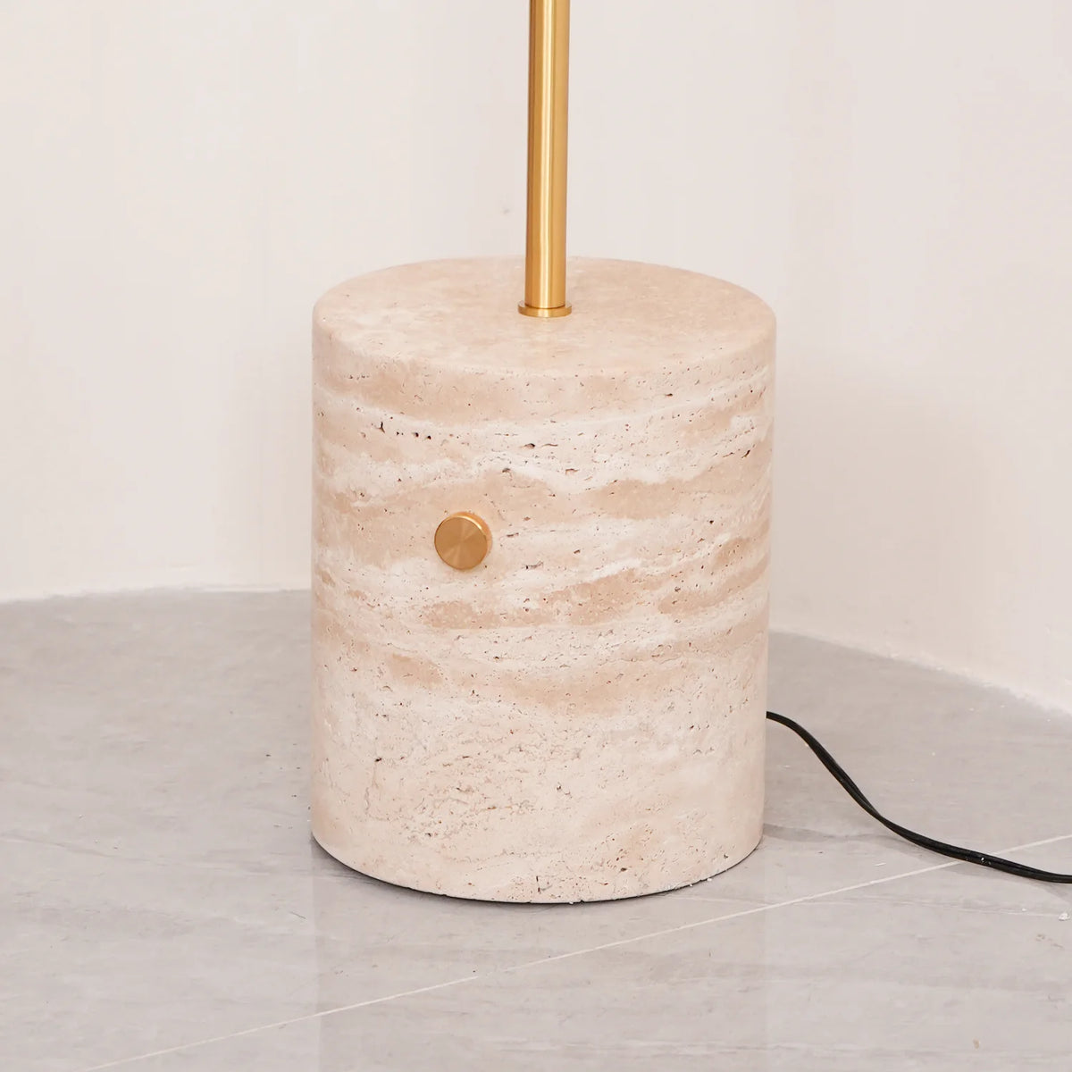 Detail of the cylindrical marble base of the Jwda Glass Floor Lamp
