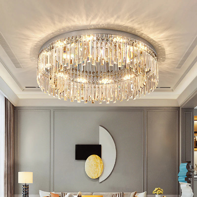 In the living room, a round crystal ceiling lamp hangs high on the ceiling, and the crystal pendants reflect warm light.
