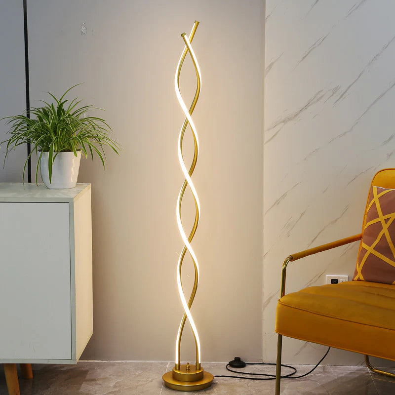 Gold Double Spiral Floor Lamp illuminating a contemporary living room.