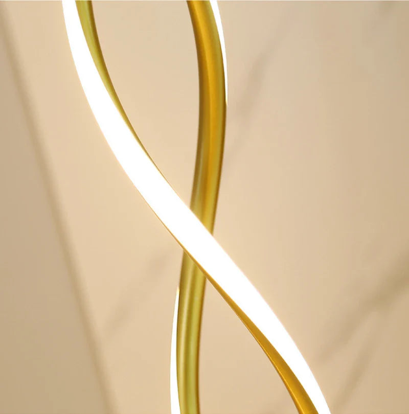 Close-up of flexible gold silicone shade on spiral floor lamp.