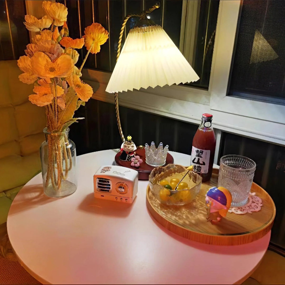 The French pleated table lamp is the perfect lighting companion for a small dining table.