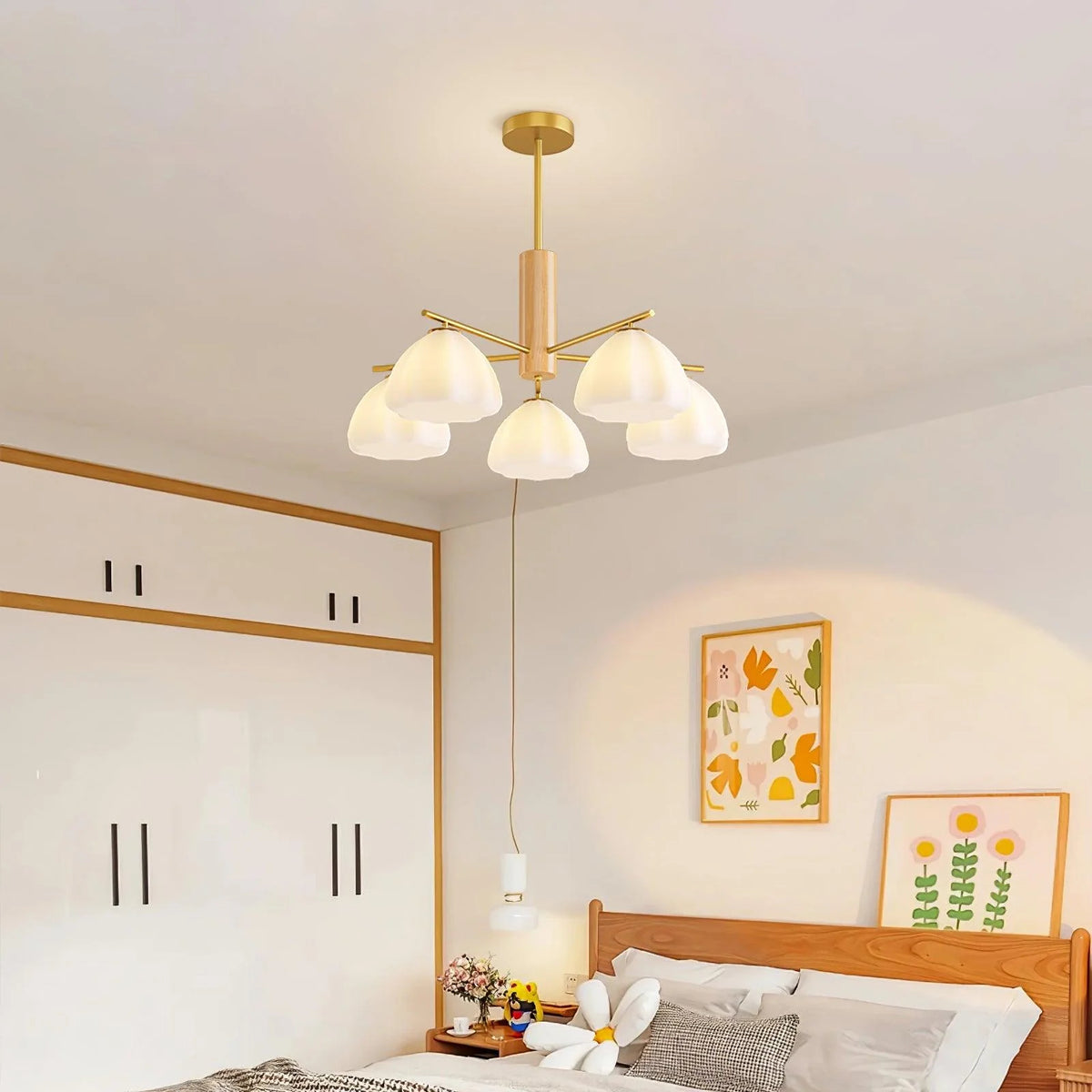 Designed as a modern pastoral piece, the flower chandelier lights up rooms with its delicate white flower shades and chic golden structure.
