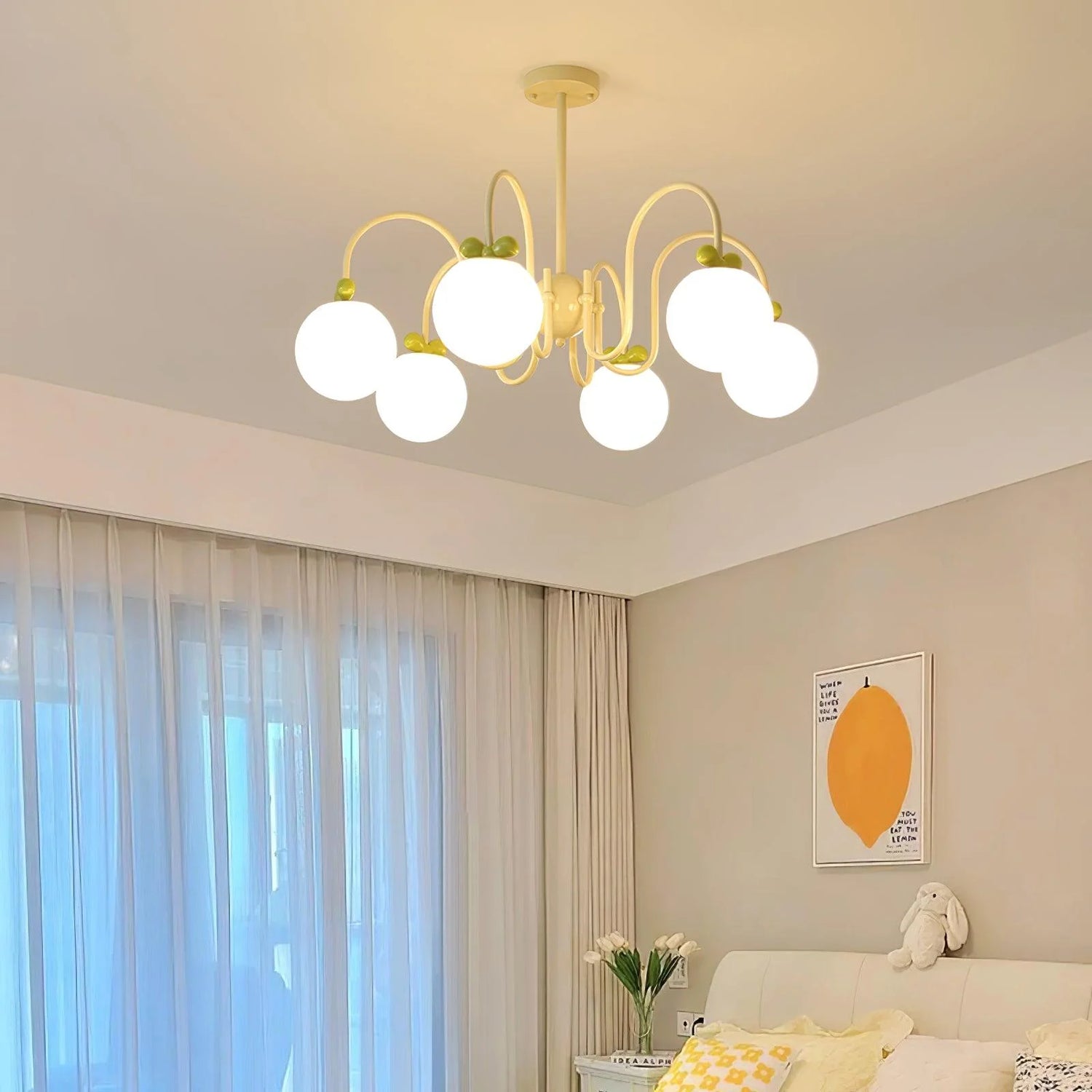 Chic chandelier: creamy white globes + green cherry accents for sweet modern decor.
