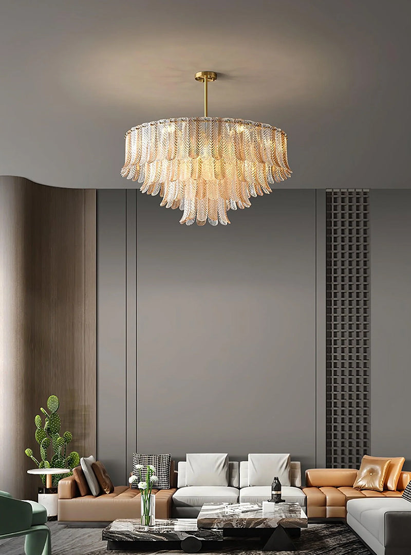 There are many sofas in the living room, but the most special thing is the multi-layered golden leaf chandelier hanging from the ceiling