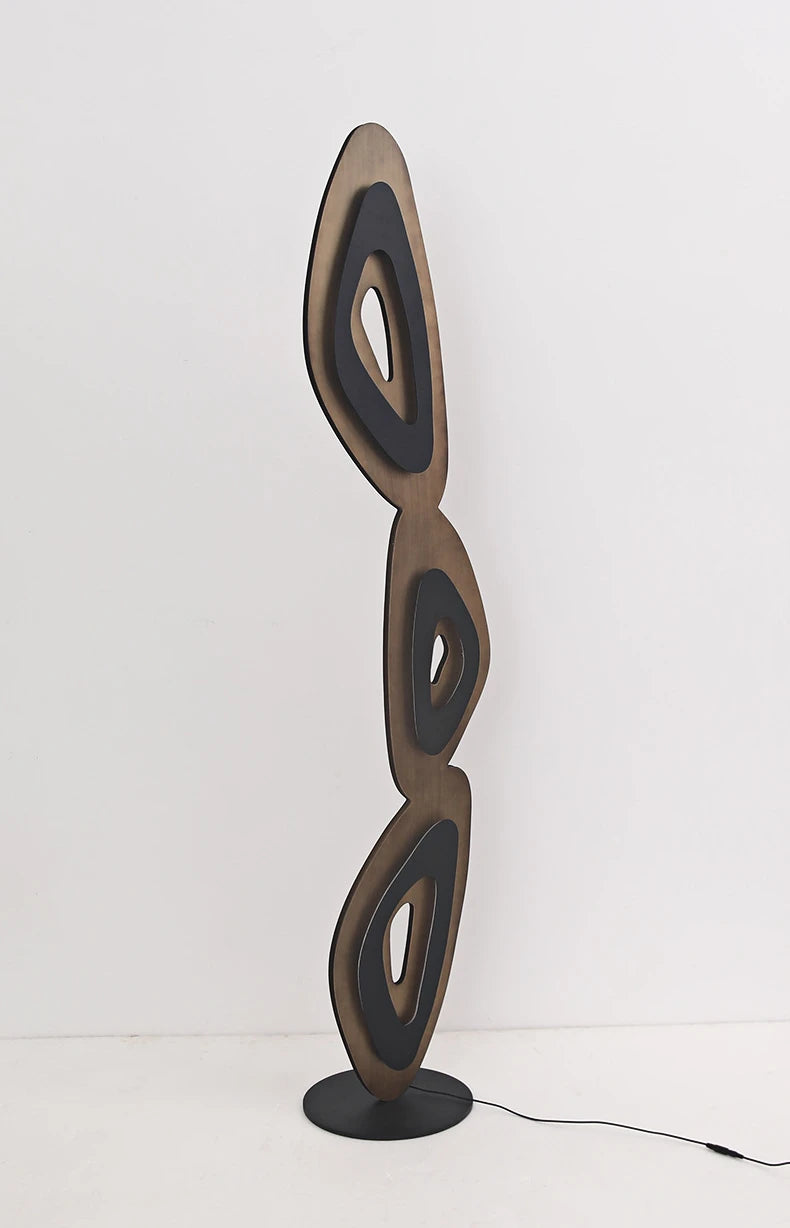 Stylish lamp’s flowing shapes deliver ambient light and modern flair.