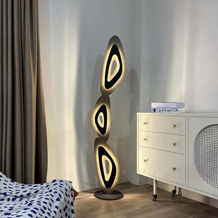 Contemporary floor lamp adds elegant glow and sculptural charm to decor.