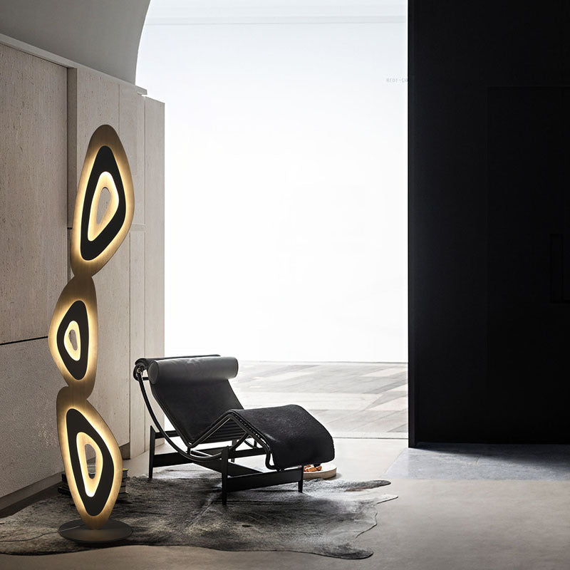 Sophisticated lamp with layered ovals elevates room aesthetics.