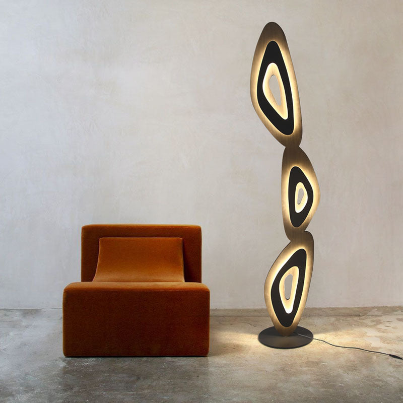 Sophisticated lamp with layered ovals elevates room aesthetics.
