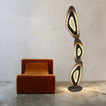 Sophisticated lamp with layered ovals elevates room aesthetics.