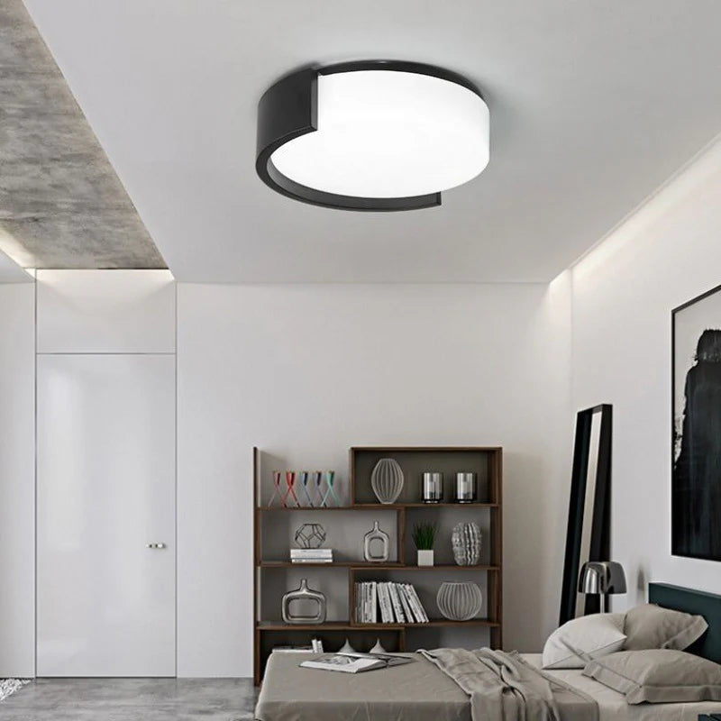 The round ceiling light features an elegant circular structure, delivering warm illumination that complements contemporary decor.