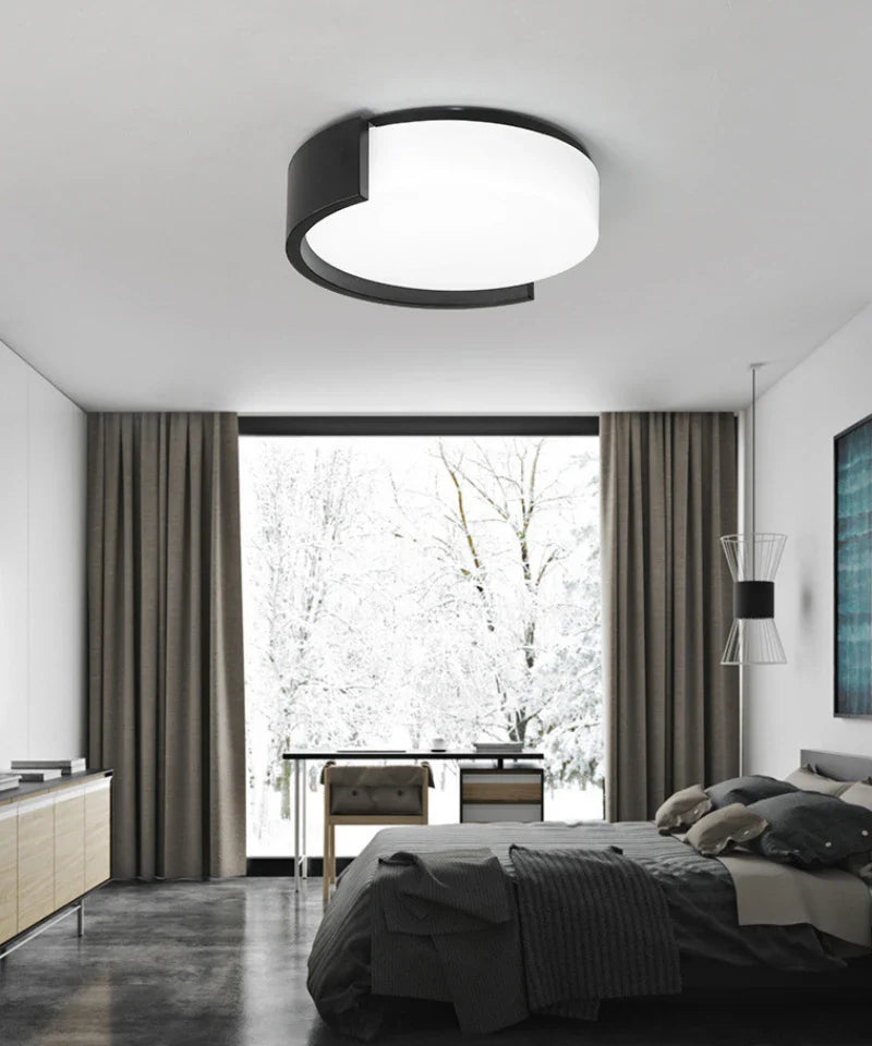 Crafted with modern sensibilities, this round ceiling light uses a minimalist circular design to spread inviting illumination.