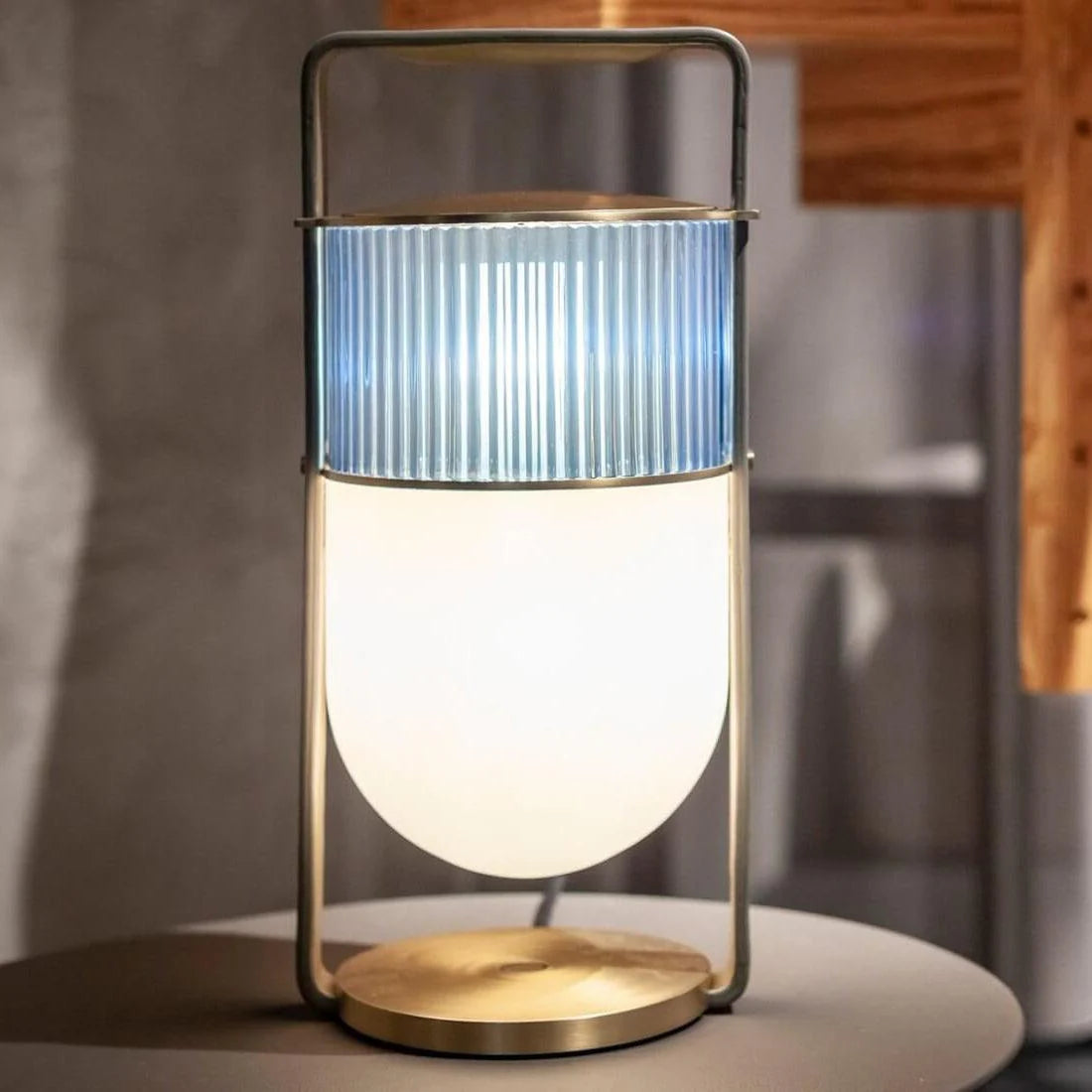 Elegant hand lamp: Nordic - inspired, with glass textures, easy to move around.