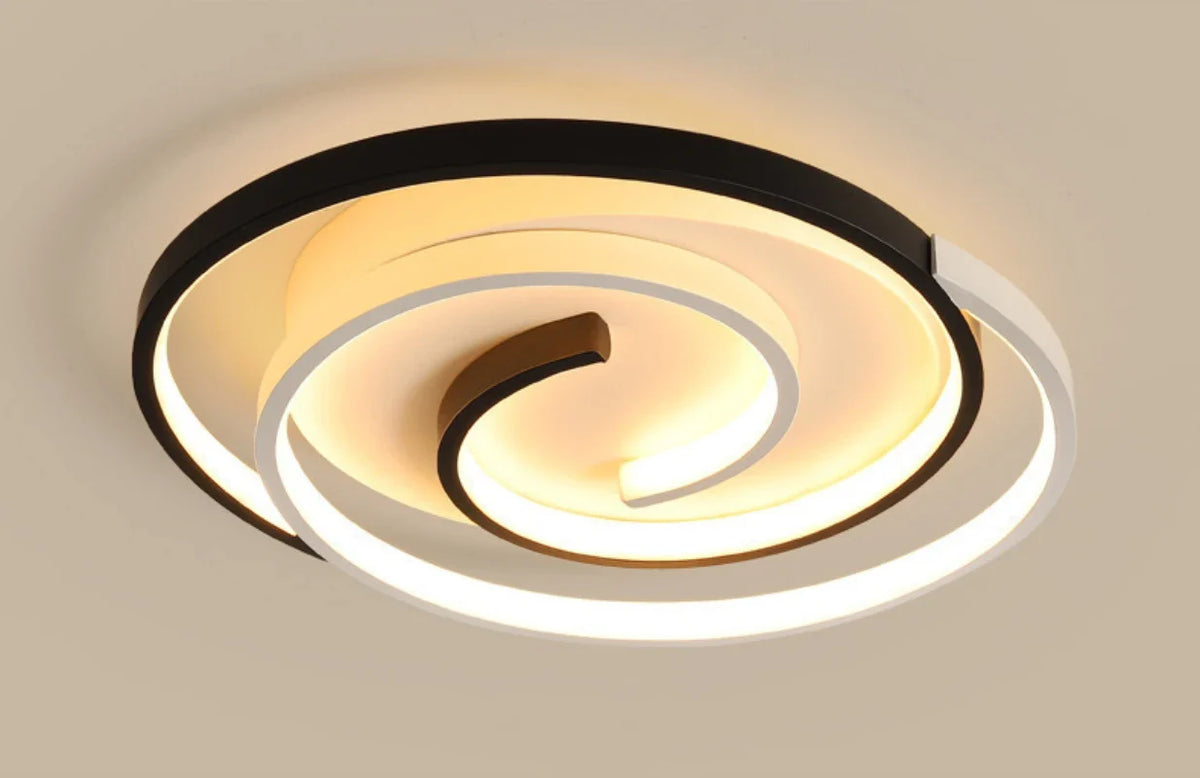 Intricately designed spiral ceiling fixture, highlighting fine craftsmanship through layered circular details.