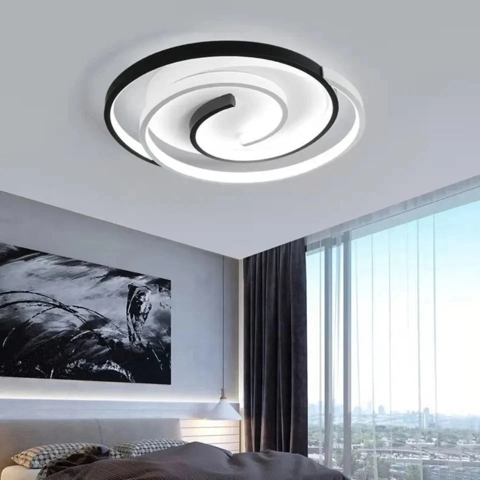 Eye-catching spiral ceiling lamp where black-and-white circles create dynamic visual appeal when lit.
