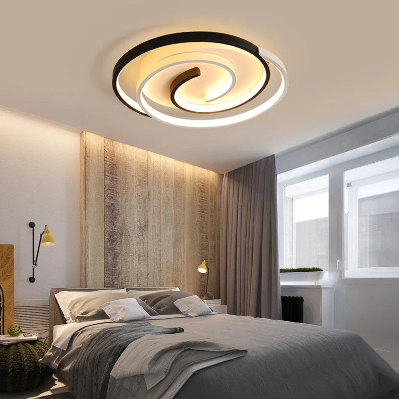 Spiral ceiling lighting that offers multi-layered light effects via its swirling circular design.