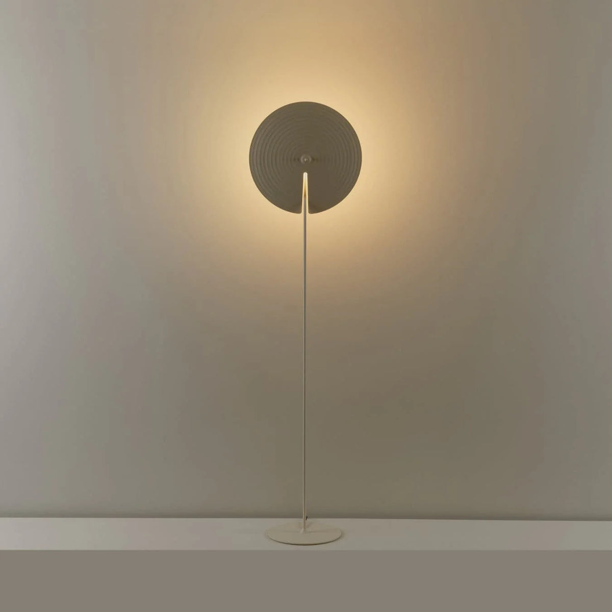 Perfect for living rooms, this floor lamp features a stable base and a slim pole for a sleek look.