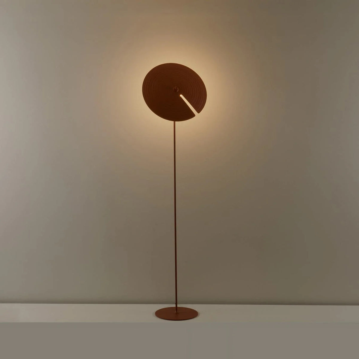 A vibe creator in the living room corner—this floor lamp lights up warm scenes with its unique design.