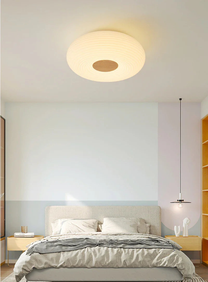 Beautiful cream round light uplifts room’s aesthetic appeal.