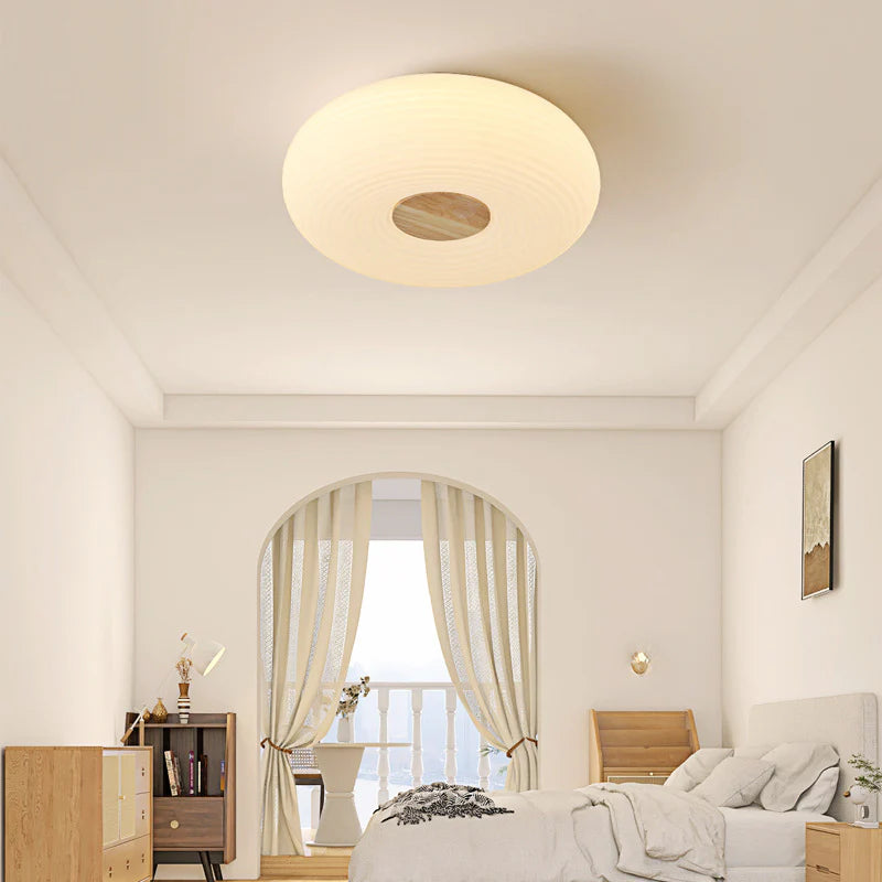 Chic cream round light adds cozy charm to living space.