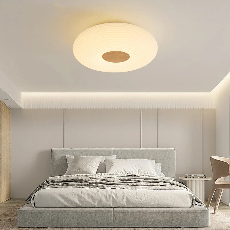 Stylish round ceiling light fits modern room lighting needs.