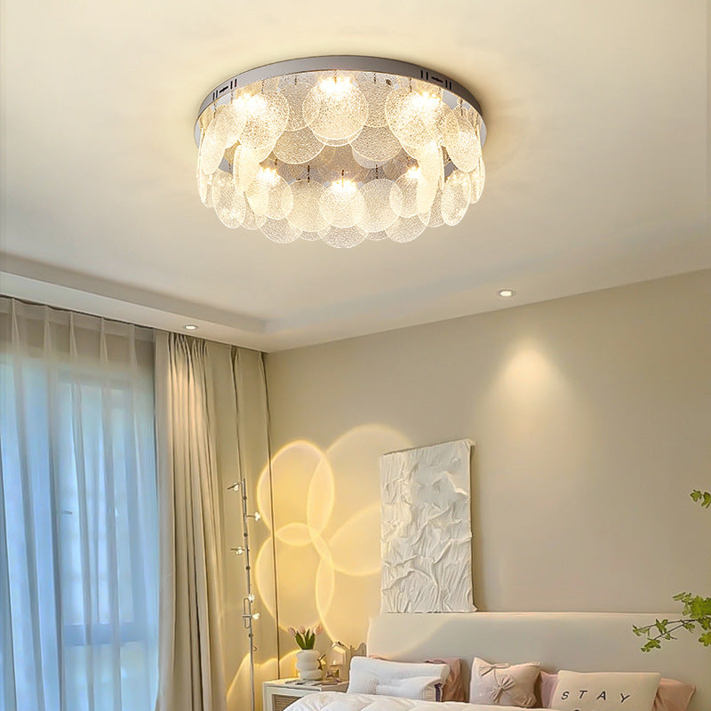The Round Shell Ceiling Light is like a dazzling piece of aerial art, hanging on the cream ceiling.