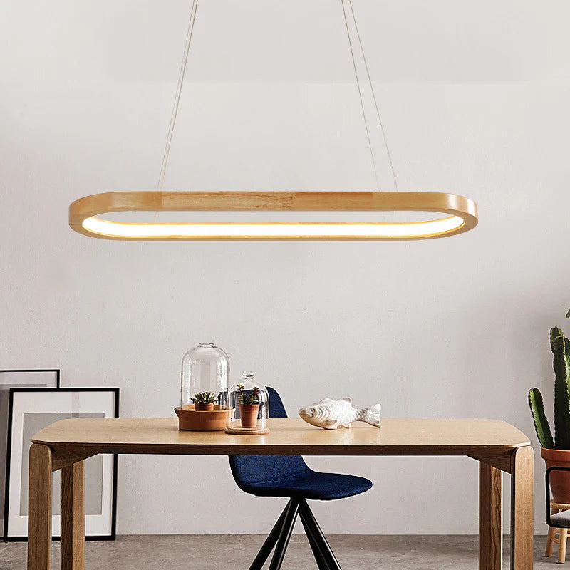 Featuring a Rubber Wood frame and Acrylic - illuminated section, this Wood Oval Led Pendant Light exudes modern charm.